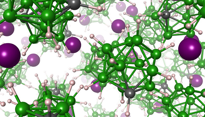 Artist's rendering of the solid electrolyte material, showing lithium atoms (purple) moving within a matrix of anions composed of boron (green), carbon (gray) and hydrogen (white) atoms.